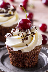 cherry cupcakes with vanilla cream .