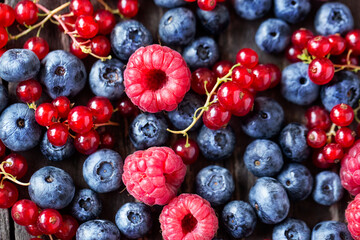 raspberry, blueberry, currant different berries background.