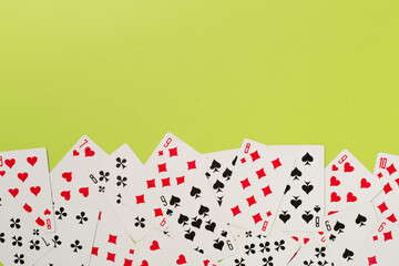 Playing cards on color background. Gambling concept. Top view
