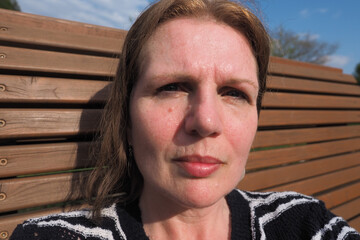 mature woman with ageing problem skin and sun damaged features