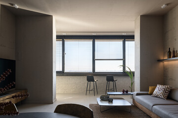 Fototapeta na wymiar Living room in loft style, apartment with open plan loft style