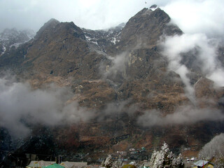 Fog engulfed the craggy terrain and coniffer pine trees after the fresh snowfall look mesmerizing at Lachung situated at 11000 ft altitude in Sikkim. Lachung is famous for its isolated natural beauty.