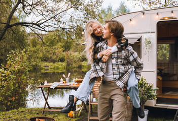 Young just married couple traveling in camper,house on wheels,trailer,motor home.Love romantic road...