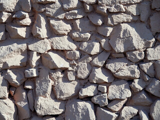 Rough stone wall. Texture of masonry.