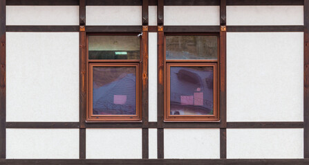 Two windows in a row on the facade of the modern urban apartment building front view, Krasnaya Polyana, Sochi, Krasnodar Krai, Russia
