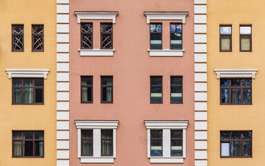 Many windows in a row on the facade of the modern urban apartment building front view, Krasnaya...