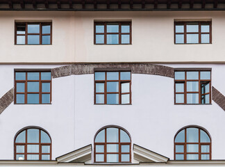 Several windows in a row on the facade of the modern urban apartment building front view, Krasnaya Polyana, Sochi, Krasnodar Krai, Russia
