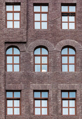 Several windows in a row on the facade of the modern urban apartment building front view, Krasnaya Polyana, Sochi, Krasnodar Krai, Russia

