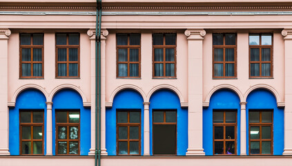 Many windows in a row on the facade of the modern urban apartment building front view, Krasnaya...