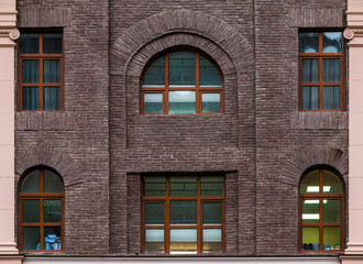 Several windows in a row on the facade of the modern urban apartment building front view, Krasnaya...