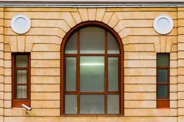 Three windows in a row on the facade of the modern urban apartment building front view, Krasnaya Polyana, Sochi, Krasnodar Krai, Russia
