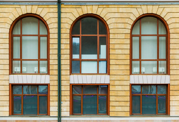 Several windows in a row on the facade of the modern urban apartment building front view, Krasnaya Polyana, Sochi, Krasnodar Krai, Russia

