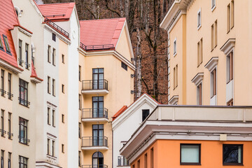 Group of parts of urban apartment buildings facades, Krasnaya Polyana, Sochi, Krasnodar Krai, Russia
