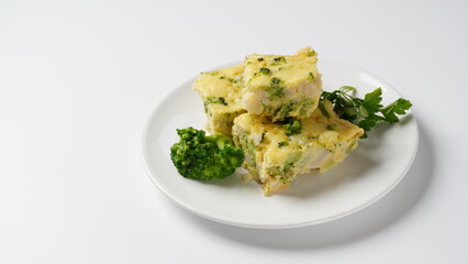 Casserole with cheese and broccoli. Broccoli gratin with melted cheese