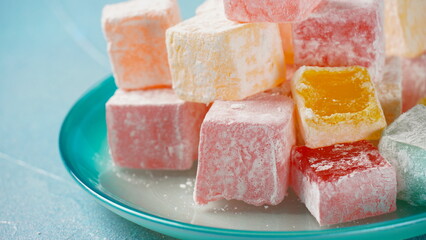 Assorted Turkish delights Rahat lokum. Colorful cubes of Turkish delights. Ramadan bayrami (eid al fitr) and Kurban bayrami (eid al adha) background photo.