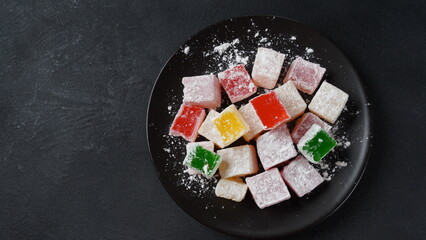 Assorted Turkish delights Rahat lokum. Colorful cubes of Turkish delights. Ramadan bayrami (eid al fitr) and Kurban bayrami (eid al adha) background photo.