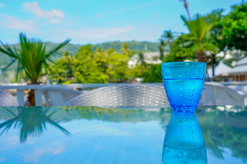 Fototapeta na wymiar Drinking water, water in cold blue glass outdoors.