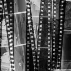 Cut strips of photographic black and white film. Close-up of black and white negatives.