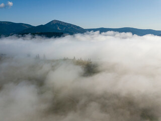Morning fog in the Ukrainian Carpathians. Aerial drone view.