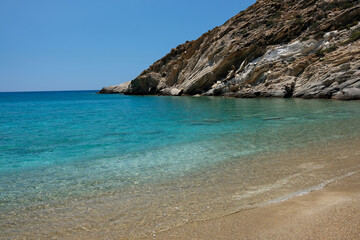 Fototapeta na wymiar Panoramic view of the stunning turquoise beach of Tripiti in Ios Greece