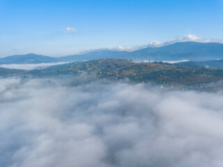 Obraz premium Morning fog in the Ukrainian Carpathians. Aerial drone view.
