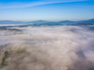 Morning fog in the Ukrainian Carpathians. Aerial drone view.
