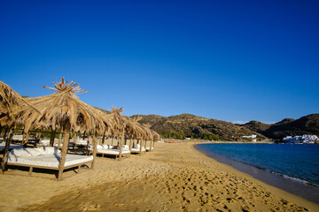 Luxury sunbeds at the famous beach of Mylopotas in Ios Greece