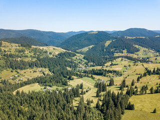 Green mountains of Ukrainian Carpathians in summer. Sunny clear day. Aerial drone view.