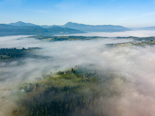 Morning fog in the Ukrainian Carpathians. Aerial drone view.