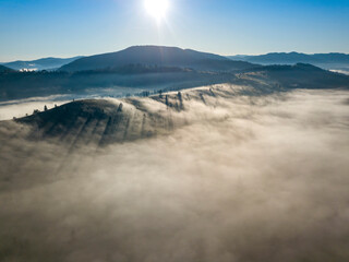 Morning fog in the Ukrainian Carpathians. Aerial drone view.
