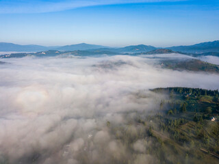 Morning fog in the Ukrainian Carpathians. Aerial drone view.