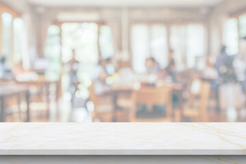 marble table top with blurred kitchen cafe restaurant interior background