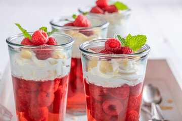 Tasty red jelly with raspberries, cream and almonds.