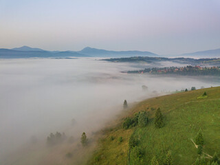 Morning fog in the Ukrainian Carpathians. Aerial drone view.
