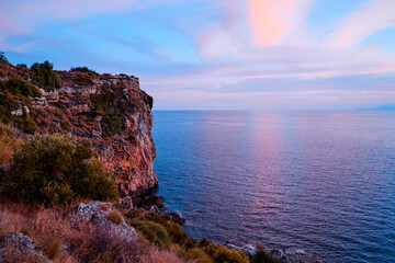 Sea cliffs and rocks on acoast. Beautiful sunset landscape.