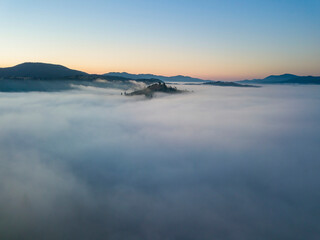 Morning fog in the Ukrainian Carpathians. Aerial drone view.