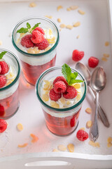 Creamy red jelly with raspberries, cream and almonds.