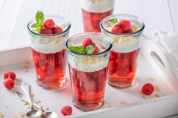 Tasty red jelly as a fruit dessert with cream.