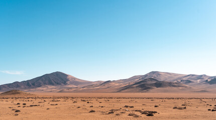 Fototapeta na wymiar Horizontal shot of mountains and dunes of the Atacama Desert, Caldera, Chile.