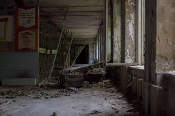 Fototapeta na wymiar Corridor in an abandoned school in Pripyat
