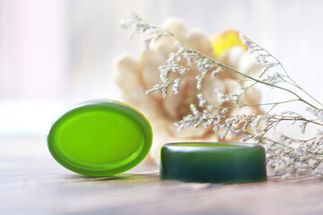 Obraz na płótnie Canvas Handmade soap, Organic green soap close-up photo on wooden background.