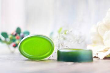 Fototapeta na wymiar Handmade soap, Organic green soap close-up photo on wooden background.