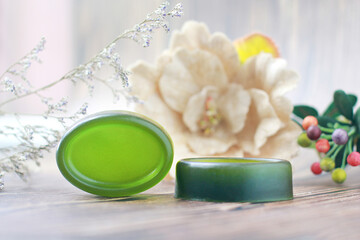 Handmade soap, Organic green soap close-up photo on wooden background.