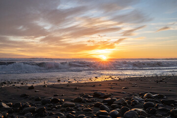 Horizontal shot of solar lens flare on Concón beach, Chile