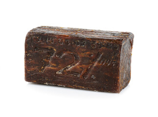 A piece of old laundry soap. Isolated on white background.