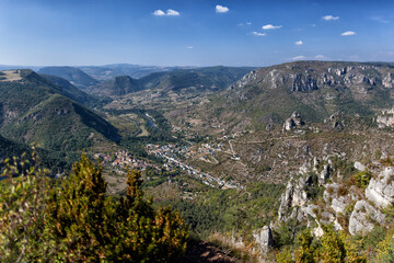 Fototapeta na wymiar Looking from the gorge cliff edge down to the town of Le Rozier.