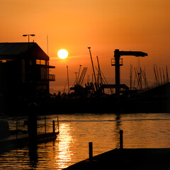 Fototapeta na wymiar golden sunrise on the pier over the sea