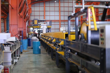 Fototapeta premium Foreman or worker work at factory site check up machine or products in site. Engineer or Technician checking Material or Machine on Plant. Industrial and Factory.