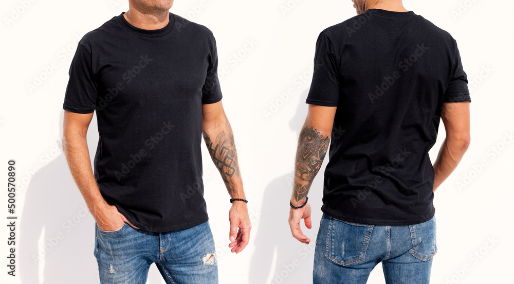 Wall mural Model wearing black men's t-shirt, mockup for your own design