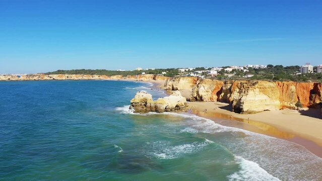The rich cliffs of the Algarve Coast towards Albufeira , Europe, Portugal, Algarve, in summer on a sunny day.